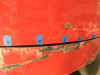 taking measurements before adjusting front of door